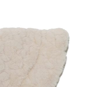 Macro view of soft faux mink fur texture with warm wavy edge detail on cream bucket hat