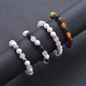 8mm lava rock and chakra natural stone yoga bracelets for men and women on a display stand