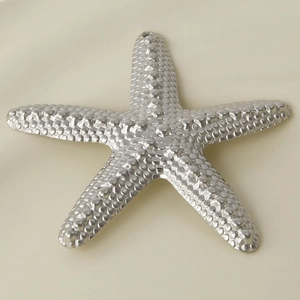 Detailed close-up of a 304 stainless steel starfish pendant with textured surface