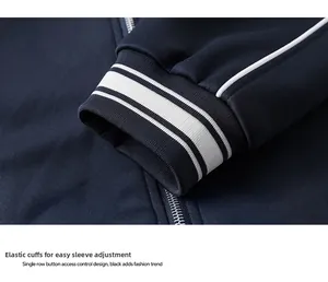 Detail of navy sports jacket ribbed elastic cuffs with white stripes and metal zipper