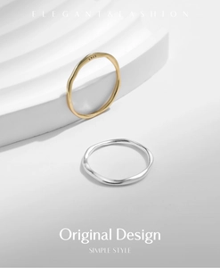Macro detail of irregular wave-textured S925 silver rings in gold and silver finishes