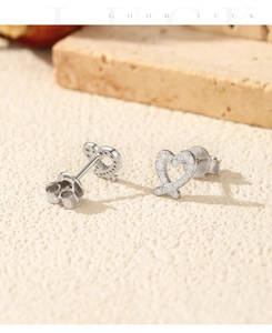 Macro shot of S925 silver heart stud earrings with sparkling pave moissanite stones