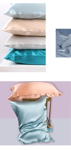 Stack of multi-colored 22 momme mulberry silk pillowcases showing luxurious satin sheen