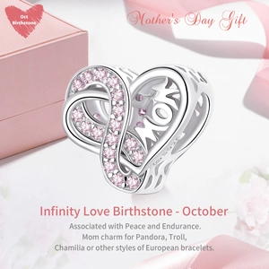Macro detail of S925 sterling silver infinity heart charm with pink birthstone
