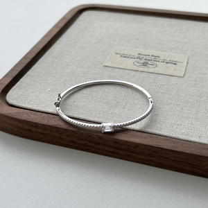 Close-up of S925 silver bracelet with geometric baguette stones and secure clasp
