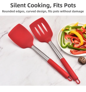 Silicone and stainless steel turner set on marble surface with colorful vegetables