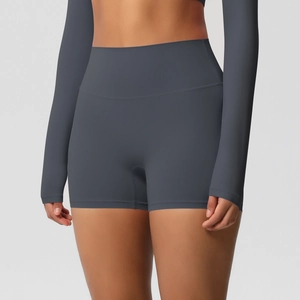 Close-up of charcoal grey high-waisted yoga shorts with tummy control and lifting effect