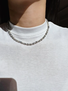 Close-up of Dalmatian Jasper beaded necklace with silver spacers on a female model