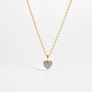 Detailed close-up of S925 sterling silver heart pendant with pavé set cubic zirconia