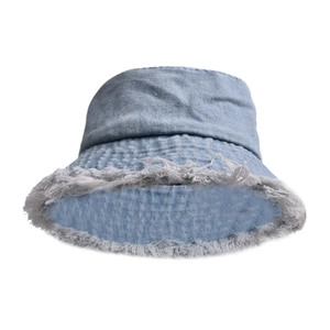 Detail shot of light blue denim bucket hat featuring vintage frayed edges and texture