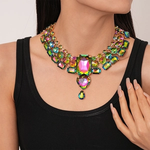 Detailed close-up of colorful rhinestone geometric necklace with heart and drop pendants