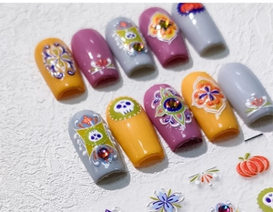 3D embossed Halloween nail stickers with skull and pumpkin patterns in orange and purple