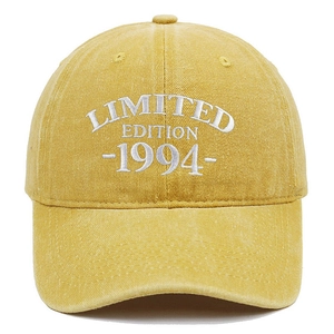 Close-up of vintage washed yellow baseball cap with 1994 limited edition white embroidery