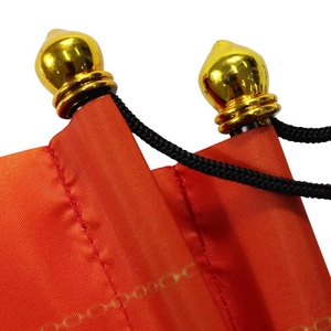 Christmas reindeer door banner with red fabric and decorative gold finial scroll tops