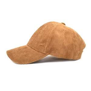 Side view of a brown corduroy baseball cap showing fine ribbed texture on white background