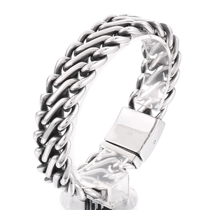 Mens silver 316L stainless steel Cuban chain bracelet on clear stand, biker style jewelry