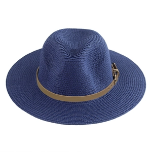 Navy blue Fedora straw hat with classic brown leather band and gold buckle on white background