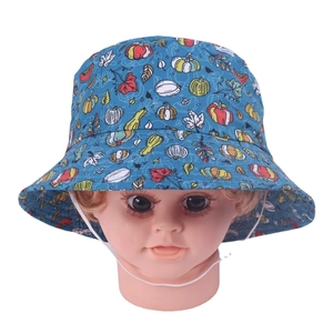 Blue baby bucket hat with autumn pumpkin prints and a white windproof chin strap