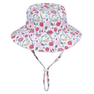 Detail of floral bucket hat for kids with adjustable chin strap and colorful pattern