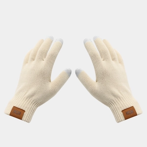Detail of off-white knitted gloves with touch screen fingertips and a MOM leather patch
