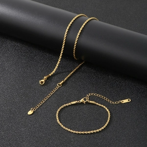 Detailed view of gold rope chain necklace and bracelet set with adjustable lobster clasps