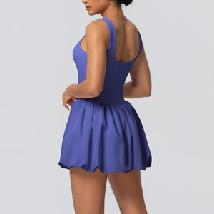 Detail view of purple tennis dress showing seamless slim fit and pleated bubble skirt