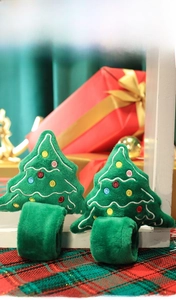 Detail of plush Christmas tree bracelets with colorful pom-poms and festive embroidery