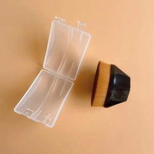 Macro detail of dense brush bristles with geometric black handle and transparent storage case