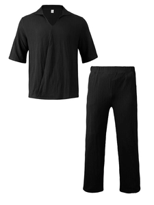 Detailed macro view of the 100% polyester pleated texture on a men's black casual set