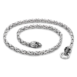 Men's hip hop king chain necklace featuring intricately carved silver skull head charms