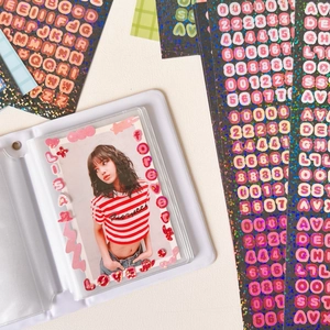 Minimalist white photocard album with holographic letter stickers and star portrait