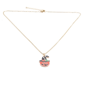 Detail of Halloween necklace with gold chain and orange pumpkin ghost pendant