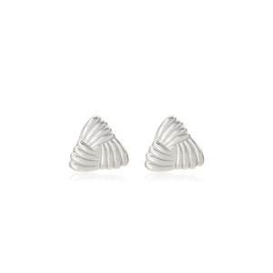 Detail of silver triangular earrings with radial texture and modern geometric design