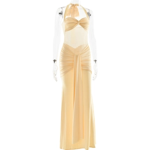 Detail of ruched beige halter dress featuring front twist knot and elegant drape