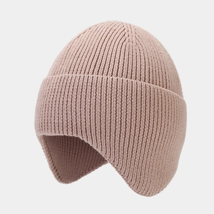 Detail of core-spun yarn texture on a dusty pink knitted beanie with ear protection