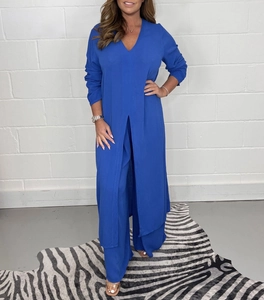 Detail of royal blue longline V-neck top with side slits and matching wide leg pants