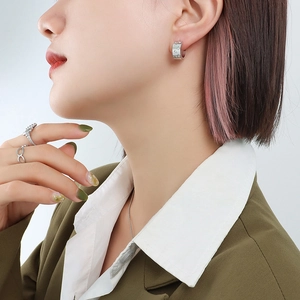 Silver geometric C-shape hoop earrings with cubic zirconia and infinity ring