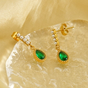 Elegant gold earrings with small pearls and a teardrop-shaped green zircon gemstone