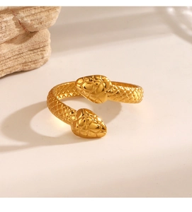Close-up of golden snake ring showing intricate scale textures and bypass design