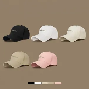 Collection of baseball caps with gold thread embroidery in five neutral fashion colors