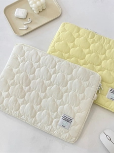 Quilted cloud pattern laptop sleeve in cream and yellow colors for iPad and notebooks