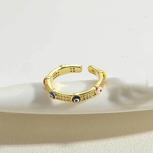 Detail of 14K gold plated adjustable ring with evil eye design and pavé crystals