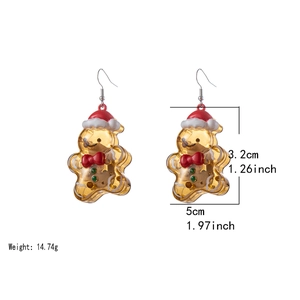 Golden resin Christmas bear earrings with red hats and white trim on white background