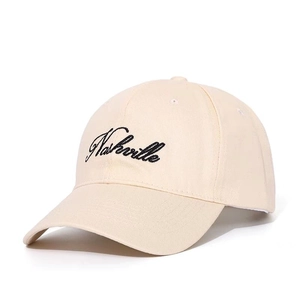 Close-up of Nashville letter embroidery on beige cotton twill baseball cap