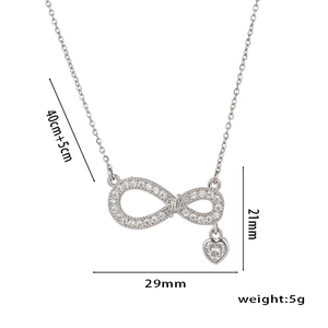 Silver infinity heart pendant necklace with zircon inlay and dimensions on white background