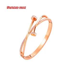 Rose gold double-wrap stainless steel nail bracelet with sparkling pavé crystals