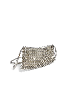 Macro detail of hand-woven silver sequin mesh bag with polished metal bead texture
