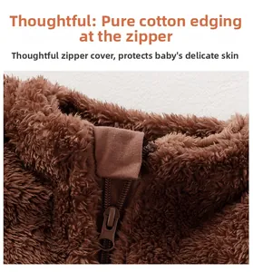 Close-up of cotton-wrapped zipper guard on a plush brown baby romper for skin protection