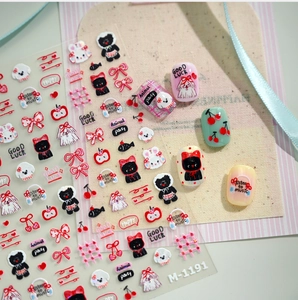 Detailed view of cute girly cartoon rabbit nail stickers with red embossed patterns