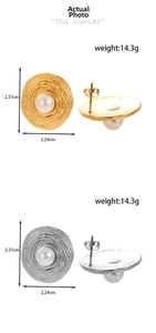 Detailed view of large round pearl earrings with gold and silver finish and dimensions